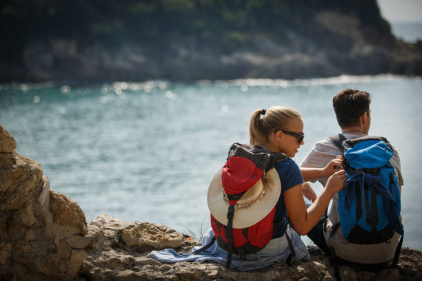 istock Hikers resting by the sea 1144346555