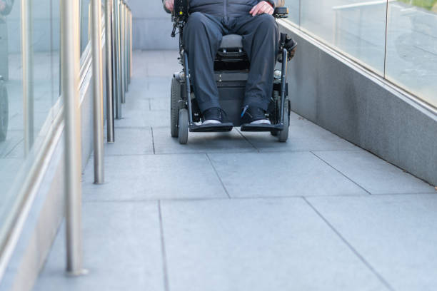 istock Man in a electric wheelchair using a ramp 1144347721