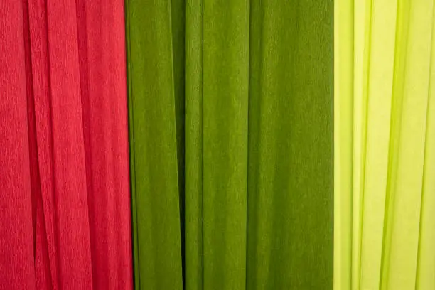 red and green crepe paper - background with crinkled texture