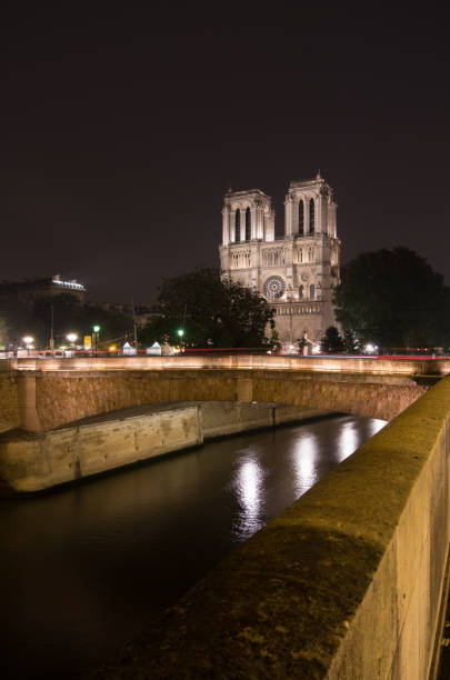 istock Notre Dame lit up at night 1144349584