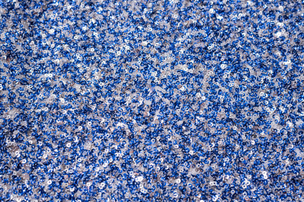istock Fabric texture with white and blue sequins. Close-up. 1144351200