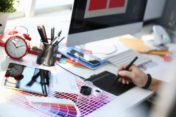 istock Designer male arm hold graphic pad pen working on project 1144352545