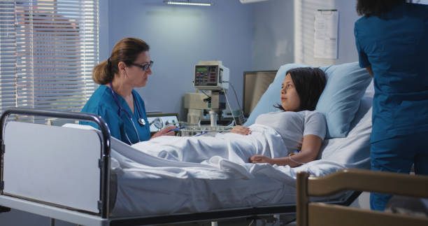 istock Doctor visiting patient in hospital 1144353484