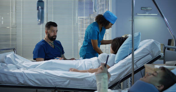 istock Patients and doctors in hospital room 1144353509