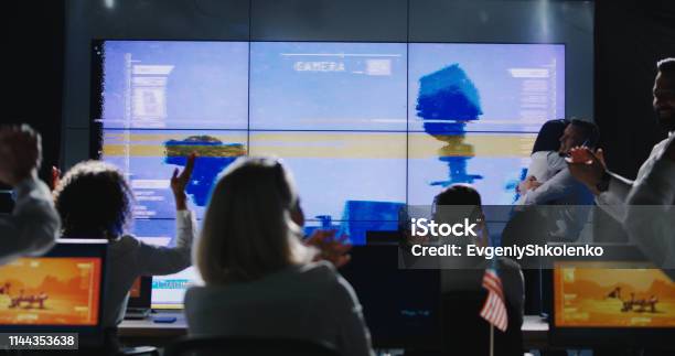 Mission Leader Giving Briefing In Control Room Stock Photo - Download Image Now - Control Room, Meeting, Space Exploration