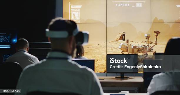 Technicians Overlooking Mars Rover Movement Stock Photo - Download Image Now - Mars Rover, Mission Control, Virtual Reality