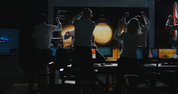 istock Ground crew celebrating in control room 1144353745