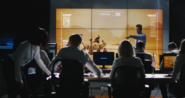 istock Mission leader giving briefing in control room 1144353768
