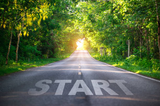 Conceptual image with word start on asphalt road ,Start line on the highway concept for business planning, strategy and challenge or career path, opportunity and change stock photo