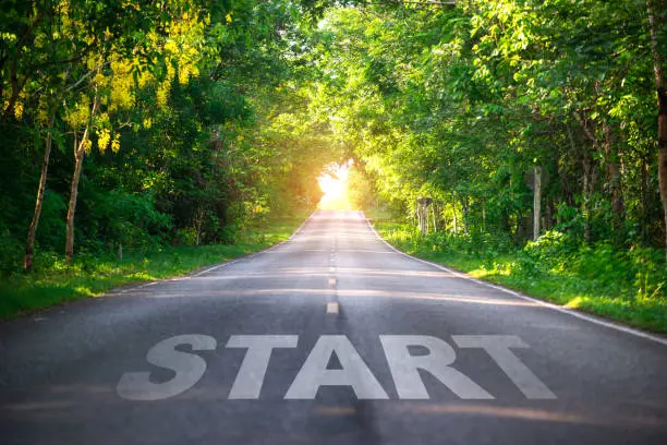 Conceptual image with word start on asphalt road ,Start line on the highway concept for business planning, strategy and challenge or career path, opportunity and change
