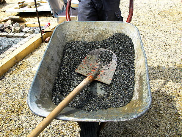 istock Wheelbarrow with a shovel and stones 114435452