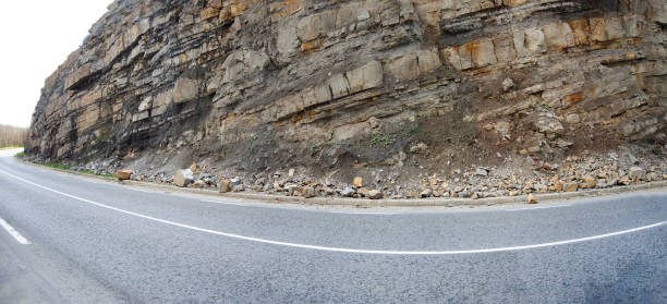 mountain asphalt road with pebble on the edge