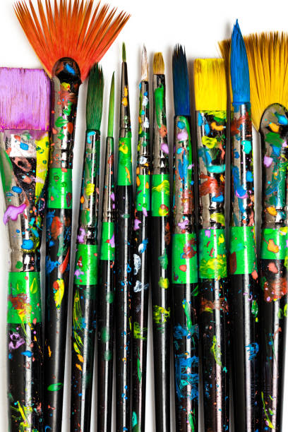 istock Set of stained paintbrushes isolated on white background. Artistic background 1144356694