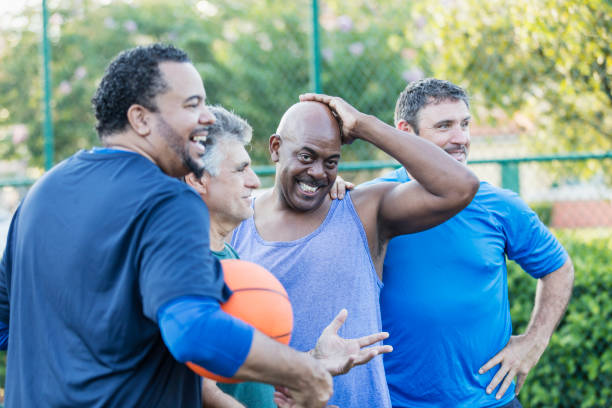 istock Multi-ethnic group of middle aged men playing basketball 1144360230