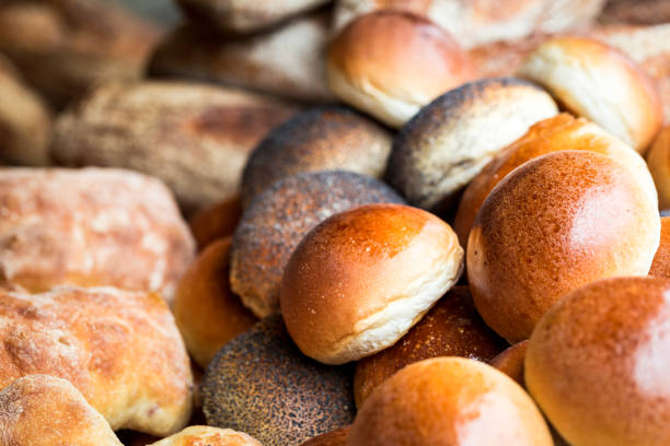 istock Stack of freshly baked artisan breads piled on top of each other 1144362084