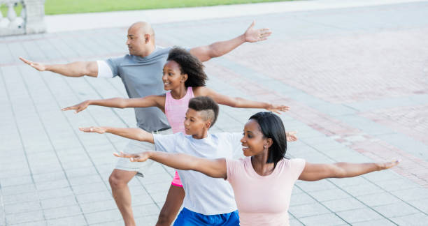 istock Interracial family exercising in park together 1144362195