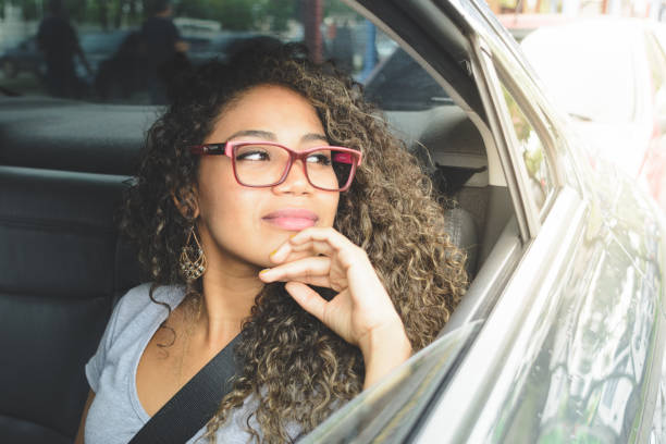 istock Woman looking out from the car window 1144362223