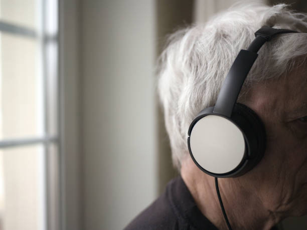 istock Senior man with headphones 1144362629