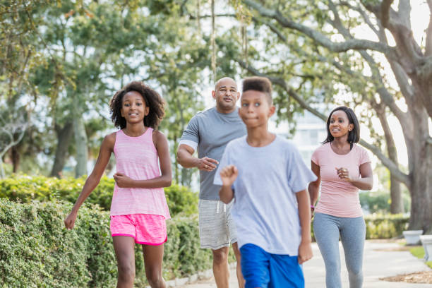 istock Interracial family walking in park together 1144363012