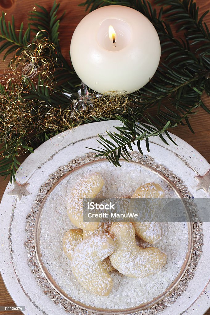 Vanille Cornets with White Candle and Knobs  TopView  Vanillekipferl Stock Photo