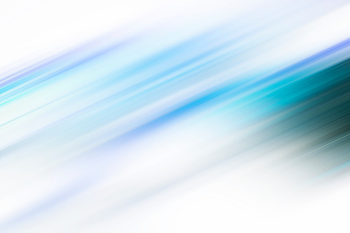 Blue motion blur abstract background, digitally generated image of blue light and stripes moving fast over black background