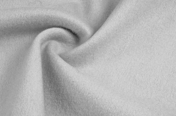 istock Texture, background, pattern. Woolen fabric for outdoor clothing, white gray 1144364214