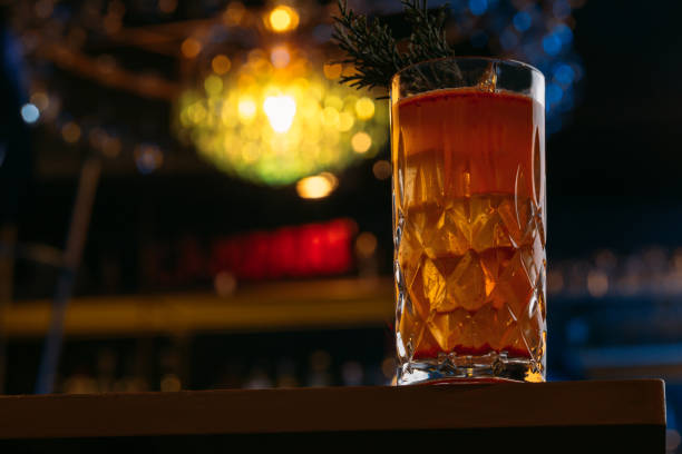 istock Amber colored cocktail on high ball glass, 1144364610