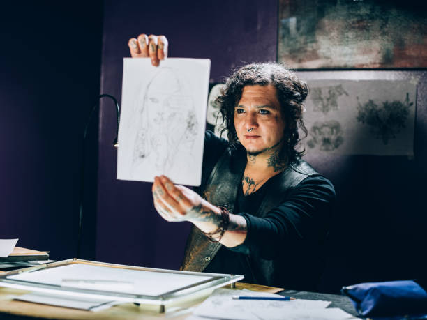 istock Tattoo artist drawing in his studio 1144366478