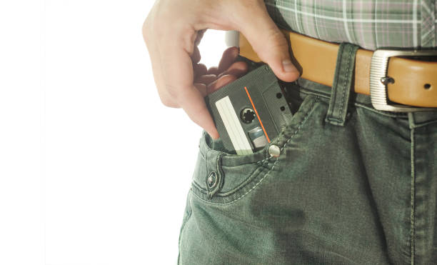 istock man holding old audio tape in jeans 1144366794