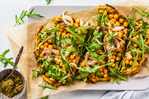 istock Green vegan pizza with pesto, chickpeas, champignons and arugula. 1144367632