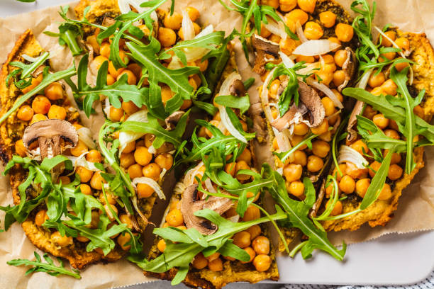 istock Green vegan pizza with pesto, chickpeas, champignons and arugula. 1144367693