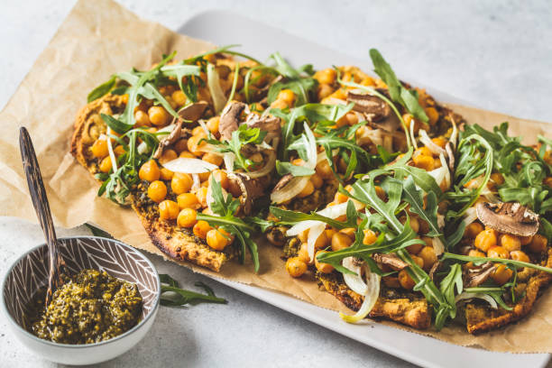 istock Green vegan pizza with pesto, chickpeas, champignons and arugula. 1144367723