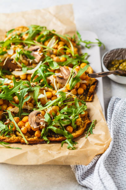 istock Green vegan pizza with pesto, chickpeas, champignons and arugula. 1144367777