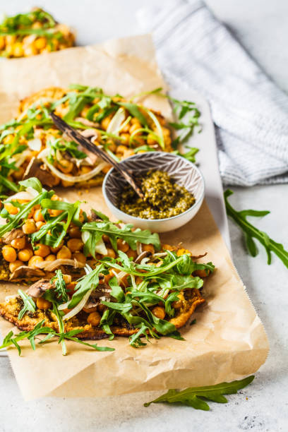 istock Green vegan pizza with pesto, chickpeas, champignons and arugula. 1144367835