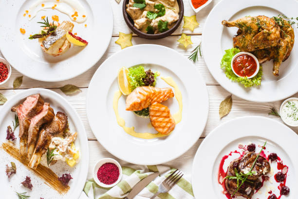 Top view of food assortment. Luxury buffet flat lay. Selection of plates and dishes on white background