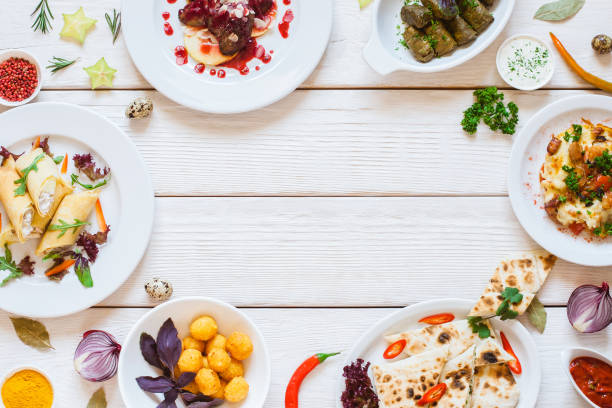 istock Frame of delicious snacks on white table flat lay 1144368624