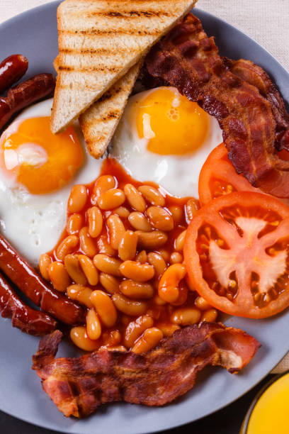 istock delicious English breakfast on a dark rustic background 1144368731