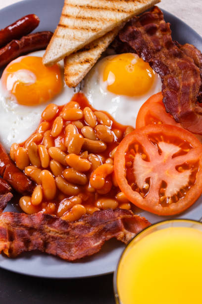istock delicious English breakfast on a dark rustic background 1144368799
