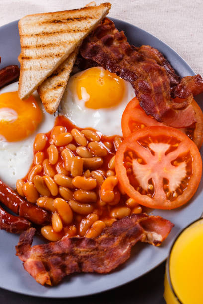 istock delicious English breakfast on a dark rustic background 1144368804