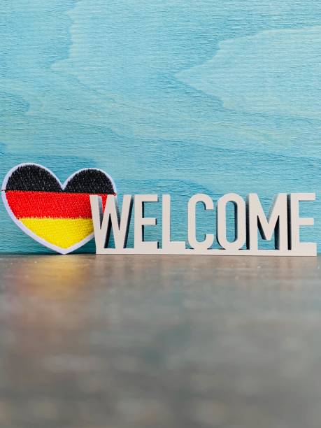 istock German flag and welcome sign on blue background 1144368856