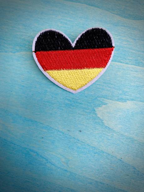 istock German flag as heart shape on blue background 1144369429