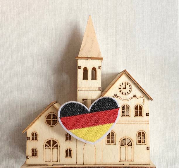 German flag as heart shape on house background