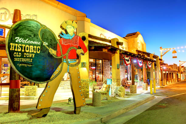Historic Old Town Scottsdale Scottsdale, Arizona, USA - March 9, 2019: The City owned iconic Old Town Scottsdale cowboy welcome sign located in the Old Town district. The sign was commissioned in 1952 and created by artist Dee Flagg. The sign was donated to the city government. historic district stock pictures, royalty-free photos & images