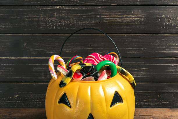 istock Happy halloween! Pumpkin with candy in the home. 1144370229