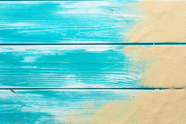 Sea sand on blue wooden floor,Top view with copy space Sea sand on blue wooden floor,Top view with copy space boardwalk stock pictures, royalty-free photos & images
