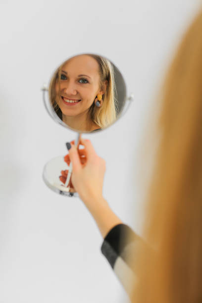 istock reflection of young woman 1144371712