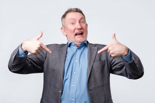 istock Man is selfish a little and is pointing with fingers at himself 1144371798