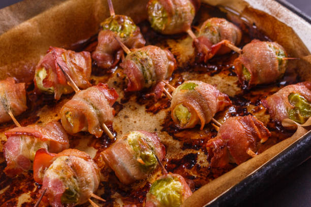 istock fresh green Brussels sprouts wrapped in fragrant smoked bacon 1144371804