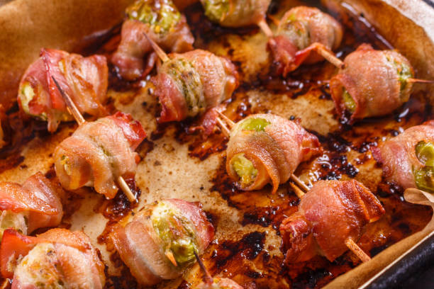 istock fresh green Brussels sprouts wrapped in fragrant smoked bacon 1144371868