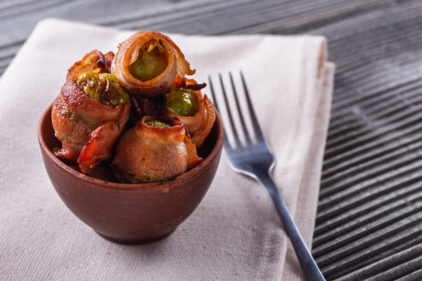 istock fresh green Brussels sprouts wrapped in fragrant smoked bacon 1144371900